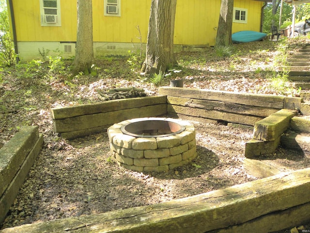 5161 Orange Grove Rd, Gosport, IN 47433 - exterior view of crawl space and a fire pit