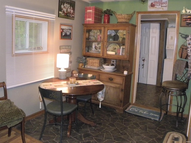 5161 Orange Grove Rd, Gosport, IN 47433 - dining room with stacked washer / drying machine and stone floors