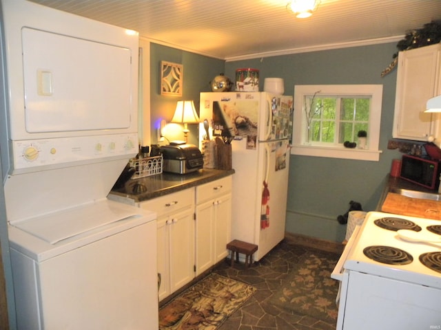 5161 Orange Grove Rd, Gosport, IN 47433 - kitchen with stacked washer / drying machine, white appliances, white cabinets, and ornamental molding