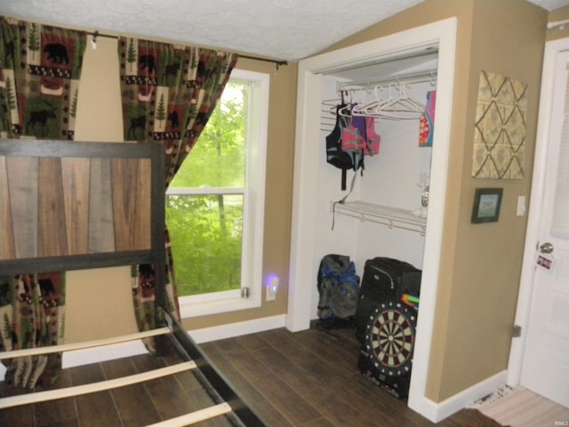 5161 Orange Grove Rd, Gosport, IN 47433 - bedroom with baseboards, wood finished floors, a textured ceiling, and a closet