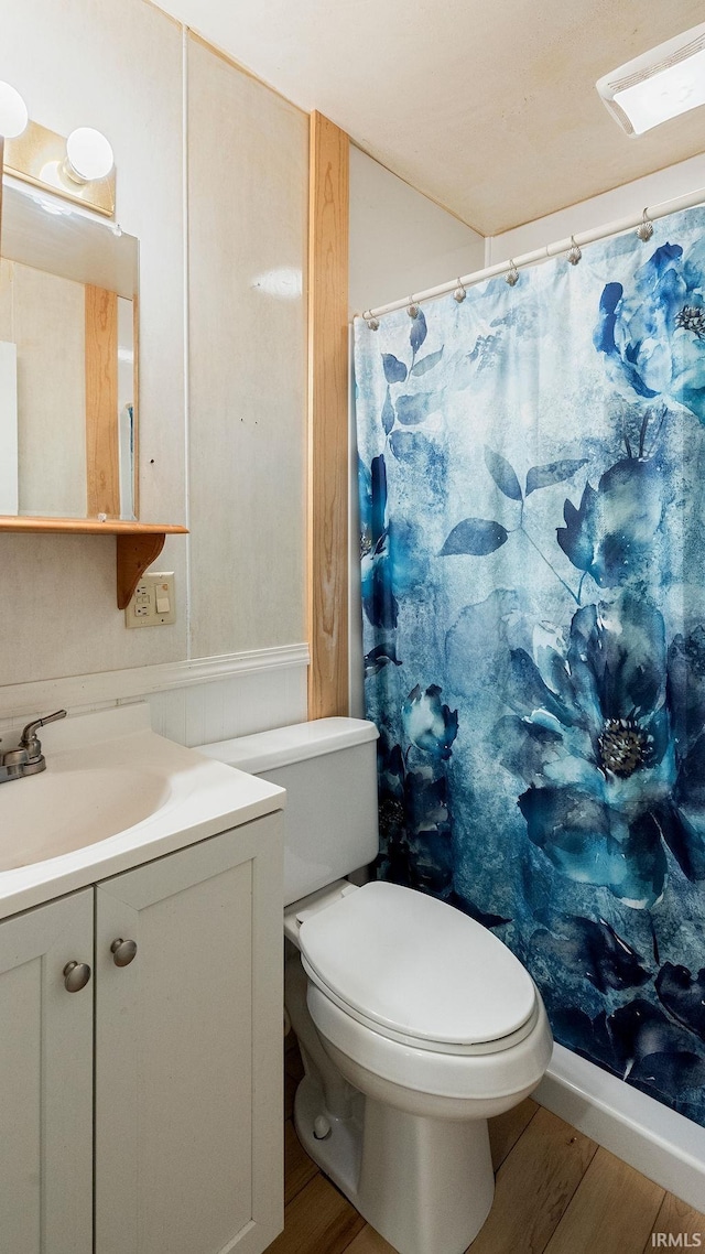 full bath with wood finished floors, vanity, toilet, and a shower with shower curtain