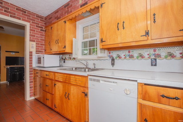 927 S Lombard Ave, Evansville, IN 47714 - kitchen with white appliances, a sink, brick flooring, light countertops, and brick wall