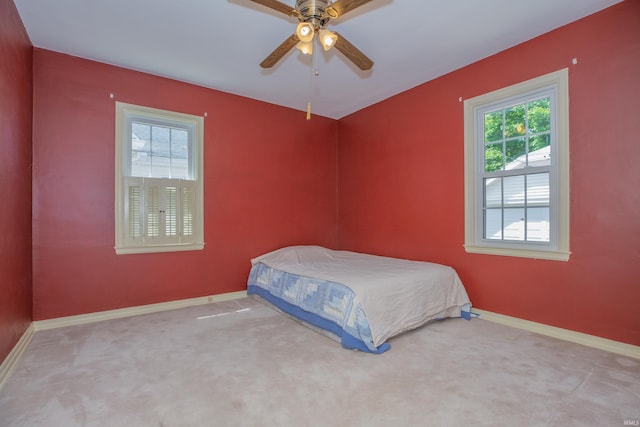 927 S Lombard Ave, Evansville, IN 47714 - carpeted bedroom featuring baseboards and ceiling fan