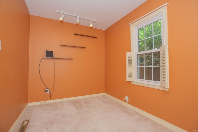 927 S Lombard Ave, Evansville, IN 47714 - spare room with track lighting, carpet, and baseboards