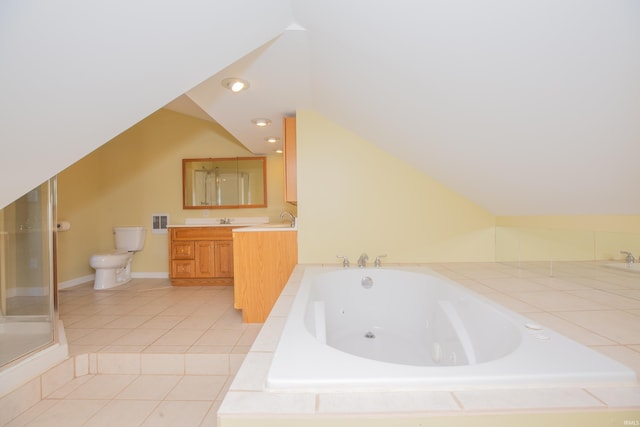 927 S Lombard Ave, Evansville, IN 47714 - bathroom featuring toilet, a whirlpool tub, lofted ceiling, vanity, and tile patterned floors