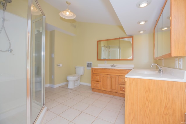 927 S Lombard Ave, Evansville, IN 47714 - bathroom featuring tile patterned flooring, a stall shower, vanity, and toilet