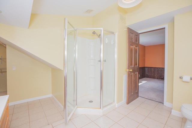 927 S Lombard Ave, Evansville, IN 47714 - full bath featuring a stall shower, tile patterned floors, toilet, and baseboards
