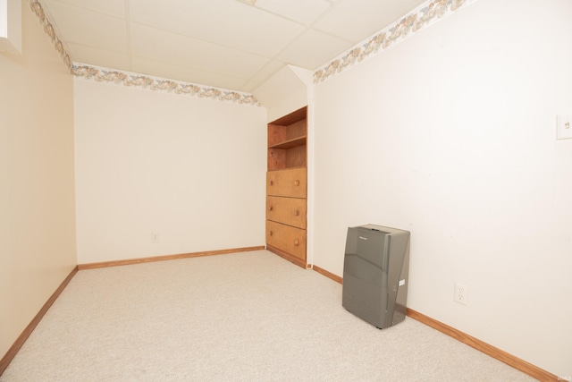 927 S Lombard Ave, Evansville, IN 47714 - empty room with light carpet, baseboards, and a drop ceiling