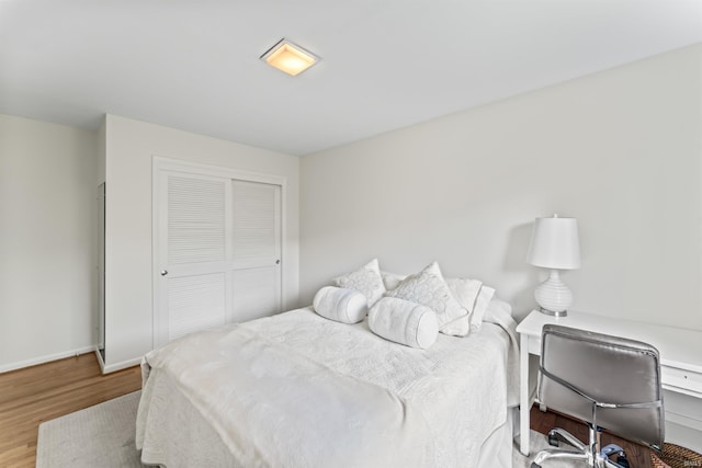 625 Cumberland Ave, West Lafayette, IN 47906 - bedroom featuring wood finished floors, a closet, and baseboards