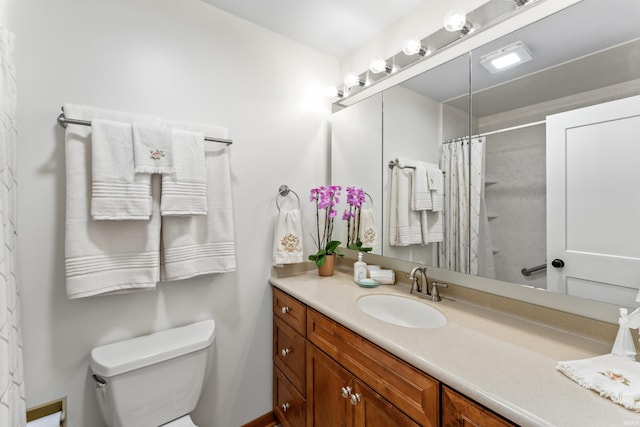 625 Cumberland Ave, West Lafayette, IN 47906 - bathroom with toilet, vanity, and curtained shower
