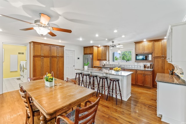 625 Cumberland Ave, West Lafayette, IN 47906 - dining room featuring washing machine and clothes dryer, recessed lighting, light wood-style flooring, ceiling fan, and ornamental molding