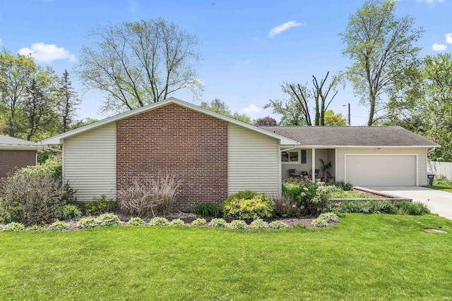 625 Cumberland Ave, West Lafayette, IN 47906 - view of front of house featuring a garage, a front lawn, and driveway
