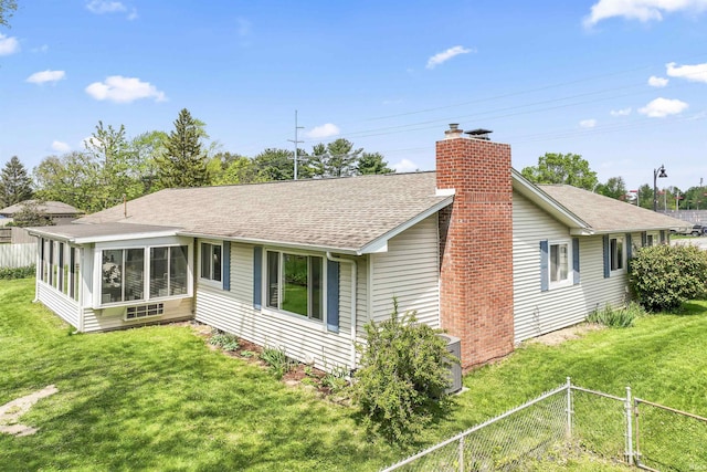 625 Cumberland Ave, West Lafayette, IN 47906 - rear view of property with a chimney, a shingled roof, and a sunroom
