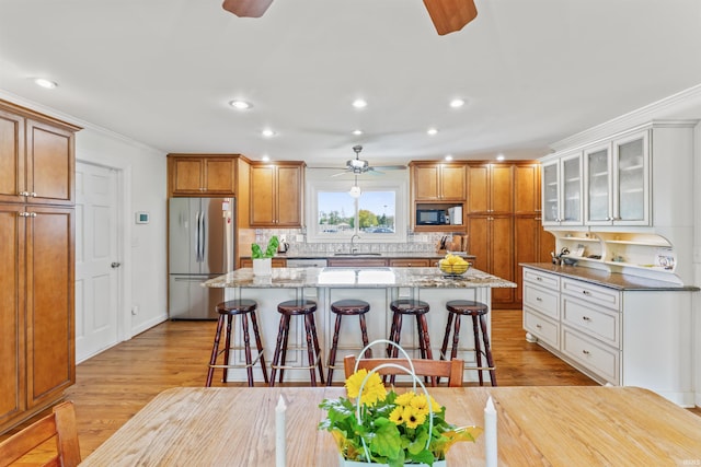 625 Cumberland Ave, West Lafayette, IN 47906 - kitchen featuring appliances with stainless steel finishes, ceiling fan, a sink, a breakfast bar area, and recessed lighting
