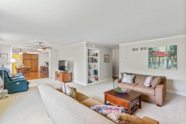 625 Cumberland Ave, West Lafayette, IN 47906 - living room featuring light colored carpet, crown molding, built in shelves, baseboards, and a ceiling fan