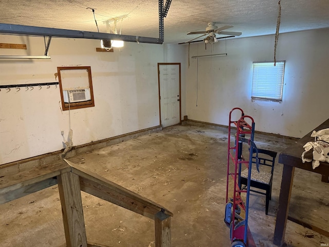 garage featuring ceiling fan, cooling unit, and a garage door opener