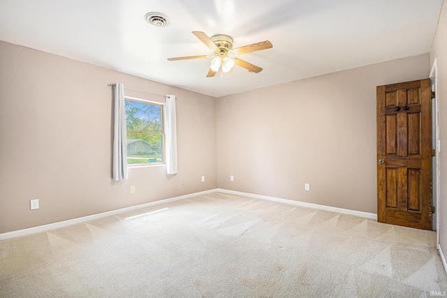 unfurnished room featuring ceiling fan, baseboards, and light colored carpet