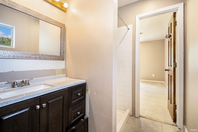 full bath featuring a stall shower, tile patterned floors, and vanity