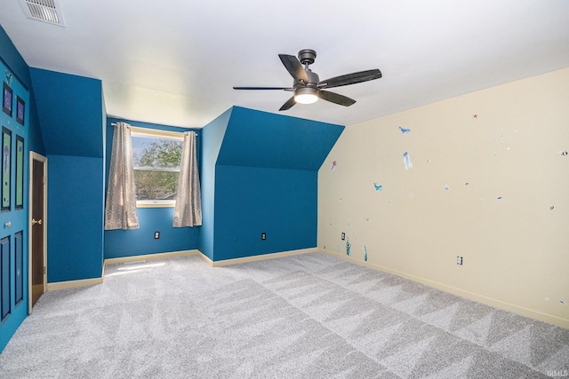 bonus room featuring a ceiling fan, carpet, baseboards, and lofted ceiling