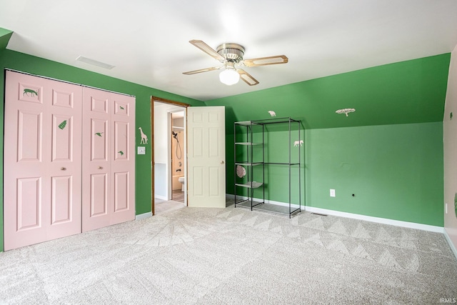 unfurnished bedroom with carpet floors and baseboards
