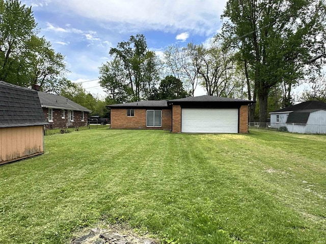 100 Lincoln St, Plainfield, IN 46168 - back of property with brick siding, an attached garage, and a shed