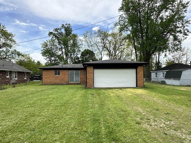 100 Lincoln St, Plainfield, IN 46168 - rear view of house with brick siding and an attached garage