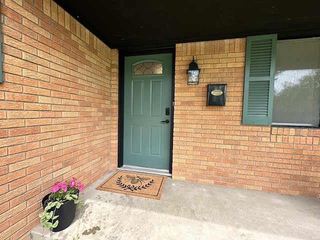 100 Lincoln St, Plainfield, IN 46168 - view of exterior entry featuring brick siding and a porch