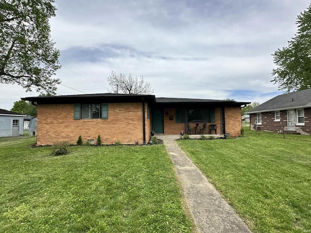 100 Lincoln St, Plainfield, IN 46168 - view of front of house featuring brick siding, a front lawn, and covered porch