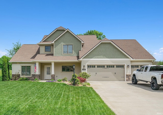 7828 E Cherokee Rd, Syracuse, IN 46567 - craftsman-style house featuring a garage, stone siding, concrete driveway, a front lawn, and a shingled roof
