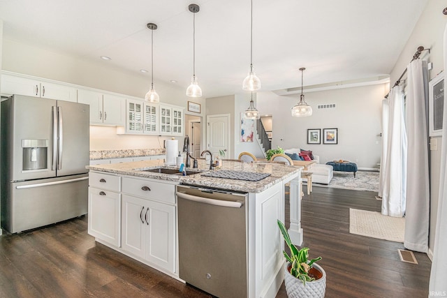 7828 E Cherokee Rd, Syracuse, IN 46567 - kitchen featuring appliances with stainless steel finishes, a sink, dark wood-style floors, white cabinets, and glass insert cabinets