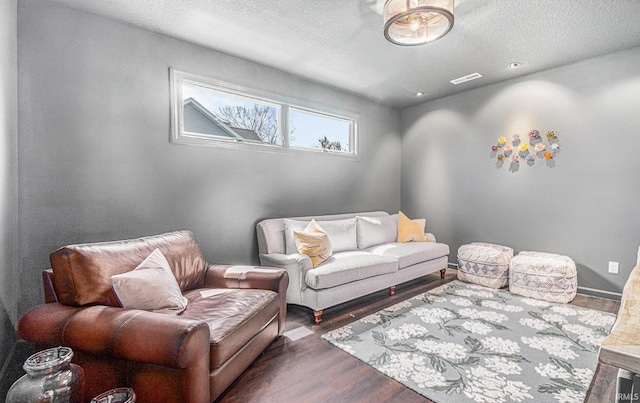 7828 E Cherokee Rd, Syracuse, IN 46567 - living area with wood finished floors and a textured ceiling