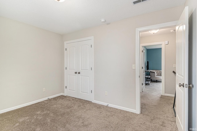 7828 E Cherokee Rd, Syracuse, IN 46567 - unfurnished bedroom with carpet flooring, a closet, and baseboards