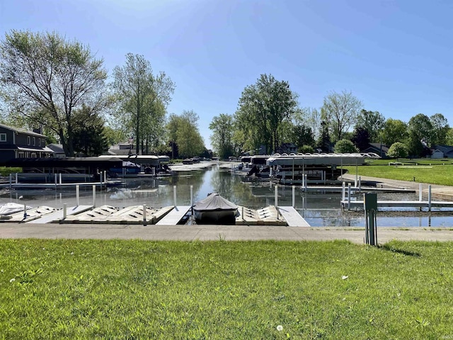 7828 E Cherokee Rd, Syracuse, IN 46567 - dock featuring boat lift, a yard, and a water view