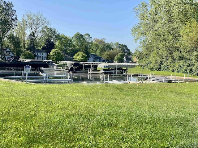 7828 E Cherokee Rd, Syracuse, IN 46567 - view of yard featuring boat lift and a boat dock