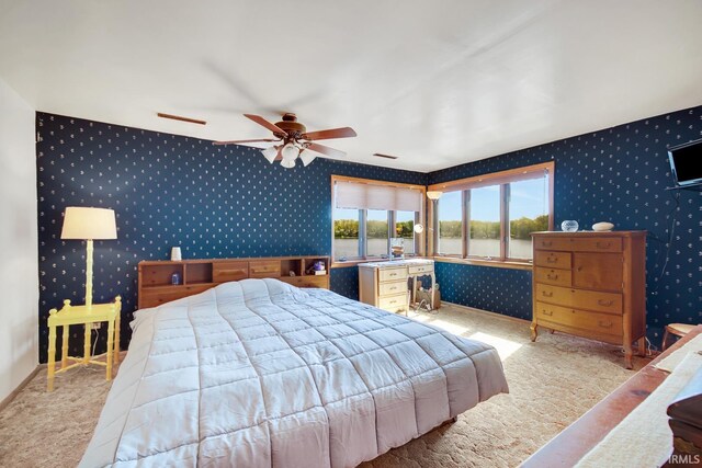carpeted bedroom with wallpapered walls