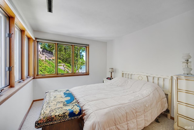 bedroom featuring carpet flooring and baseboards