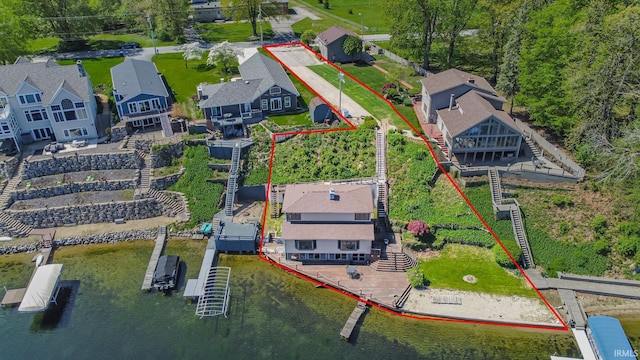 aerial view of property's location with property boundaries highlighted and a nearby body of water