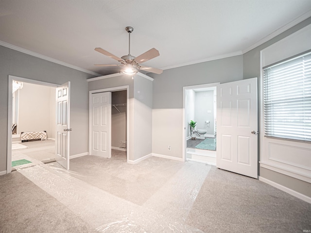 630 E Water St, Mount Vernon, IN 47620 - unfurnished bedroom with light carpet, crown molding, baseboards, a closet, and connected bathroom