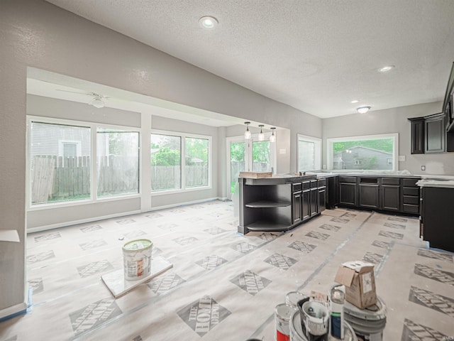 630 E Water St, Mount Vernon, IN 47620 - kitchen featuring light countertops, a textured ceiling, open shelves, dark cabinets, and recessed lighting