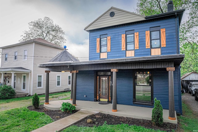 630 E Water St, Mount Vernon, IN 47620 - view of front facade featuring covered porch and a chimney