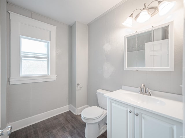 630 E Water St, Mount Vernon, IN 47620 - bathroom with wood finished floors, toilet, vanity, and baseboards