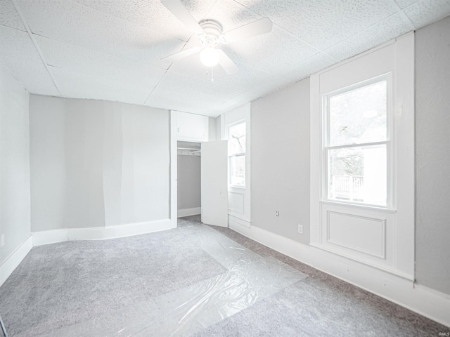 630 E Water St, Mount Vernon, IN 47620 - unfurnished bedroom featuring a paneled ceiling, a ceiling fan, a closet, and baseboards