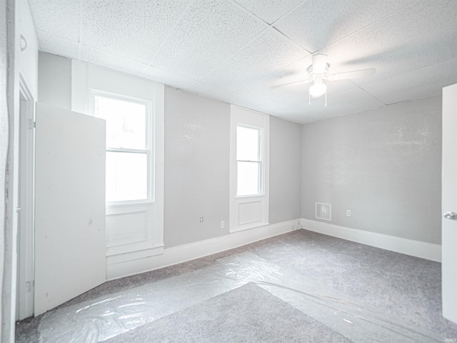 630 E Water St, Mount Vernon, IN 47620 - empty room with ceiling fan, a drop ceiling, and baseboards
