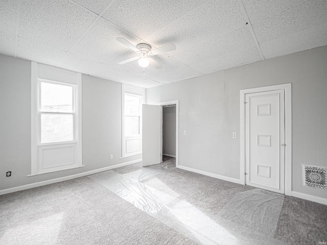 630 E Water St, Mount Vernon, IN 47620 - unfurnished bedroom with carpet, ceiling fan, baseboards, and a paneled ceiling