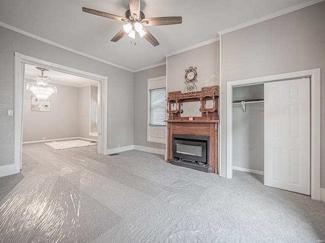 630 E Water St, Mount Vernon, IN 47620 - carpeted living room with ornamental molding, a ceiling fan, baseboards, a chandelier, and a glass covered fireplace