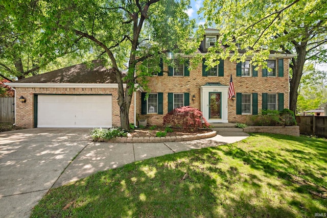colonial home with concrete driveway, brick siding, and an attached garage