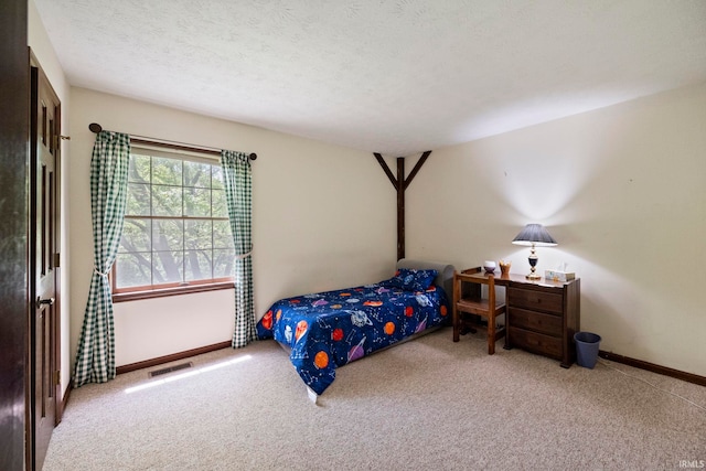 bedroom with carpet flooring and baseboards