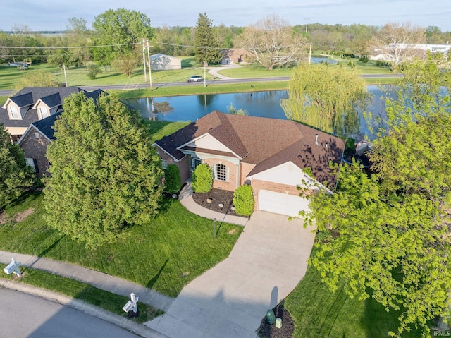 aerial view of property and surrounding area featuring a large body of water