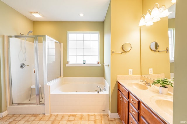 full bathroom with a shower stall, a bath, and double vanity