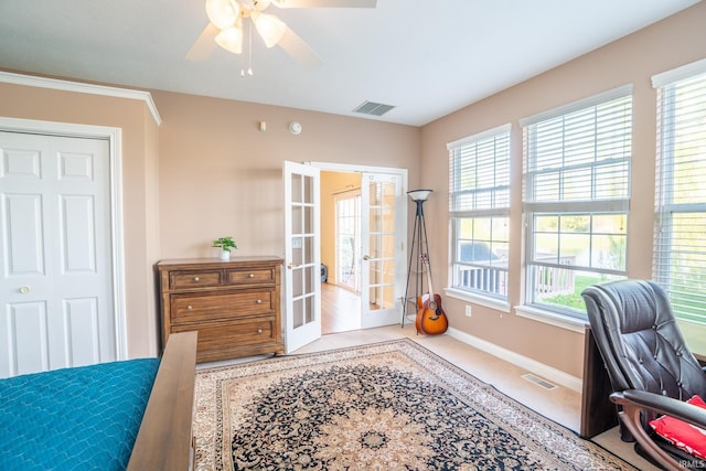 office area featuring french doors, a ceiling fan, and baseboards